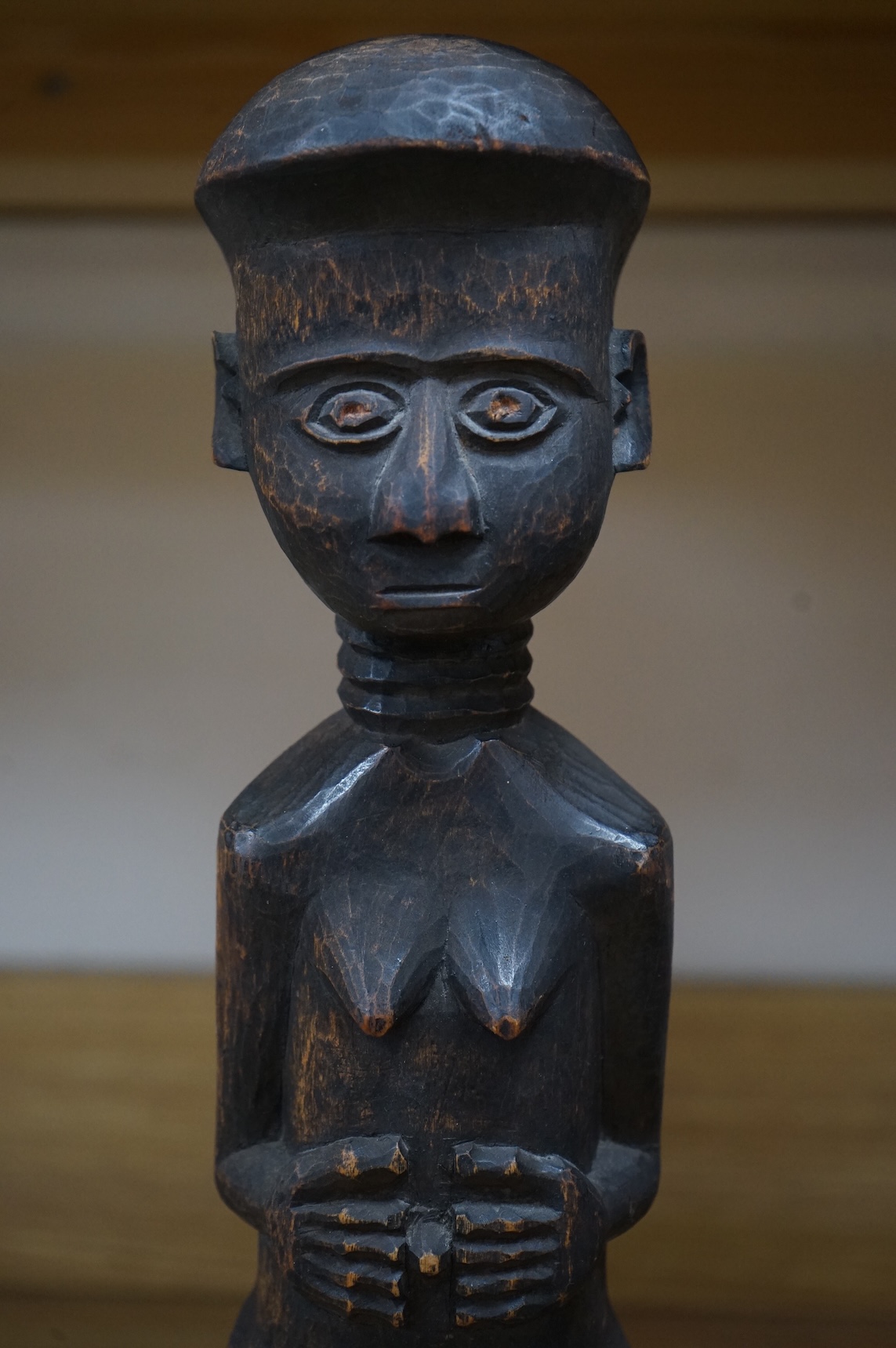 A Fang peoples female reliquary figure, Equatorial Guinea, Provenance - vendors grandfather in law brought back from Africa when working in the Gold Coast late 19th/early 20th century, on stand, 36cm high not including s